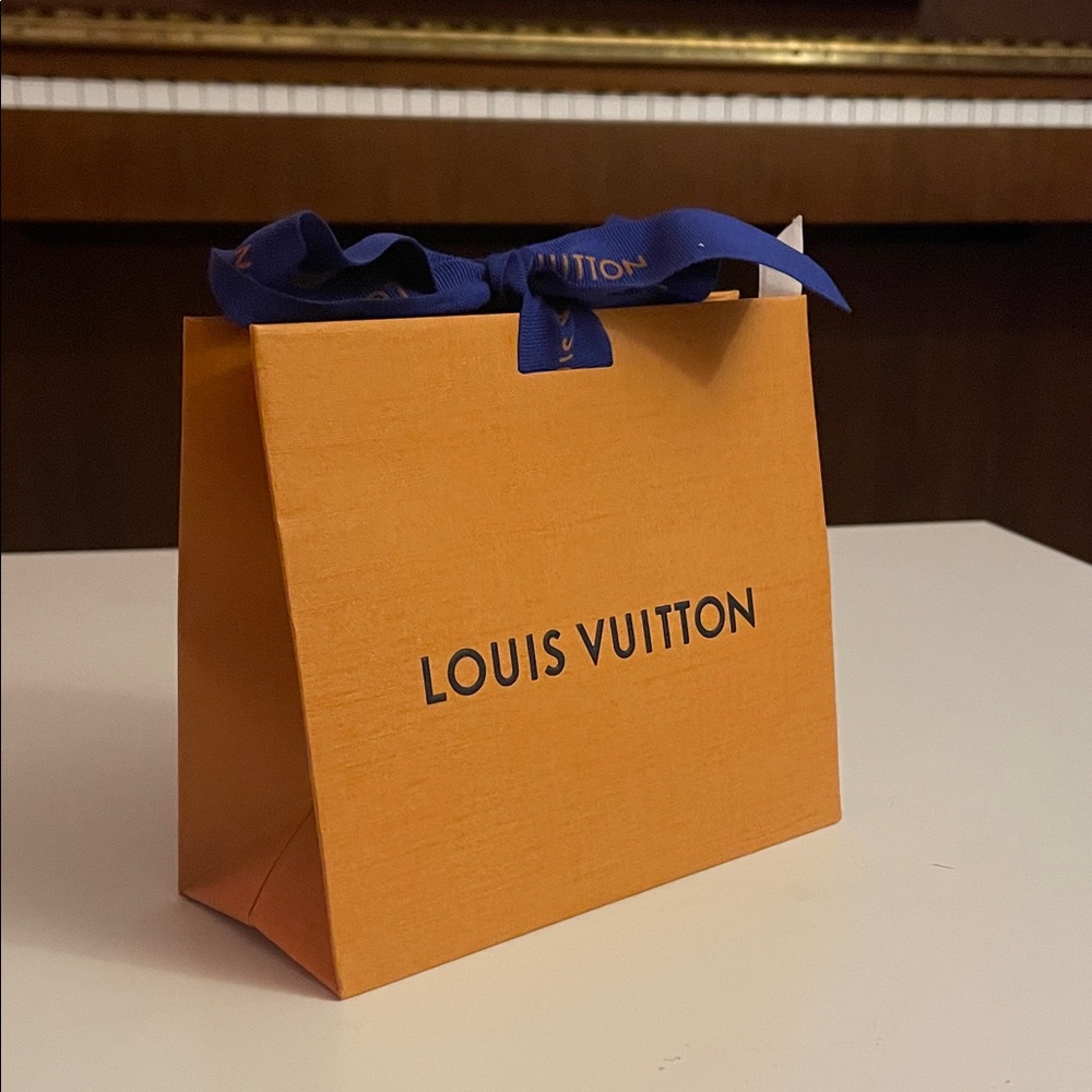 Louis Vuitton Vibrant Orange Bag with Bold Blue Ribbon